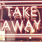 Cartel luminoso con la frase 'Take Away'